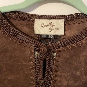 Leather jacket with covered buttons.